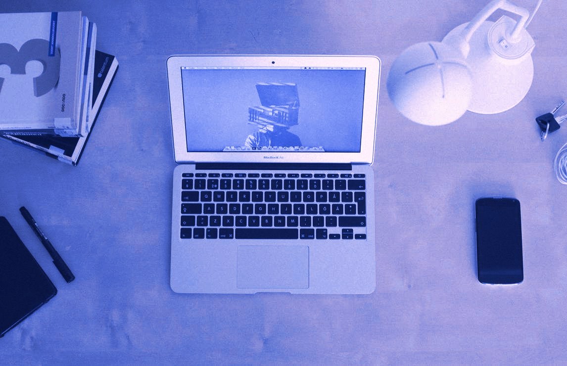 A laptop and a phone side by side on a desk, responsive Websites & Ecommerce builds at Devodin